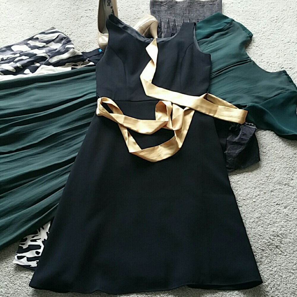 Black formal dress, mid length, not long.